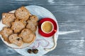 Homemade gingerbread cookies and red and blue cups with coffee on tray on grunge gray wooden background. Christmas and New Year Royalty Free Stock Photo