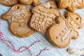 Homemade gingerbread cookies on tray with cup of coffee on grunge gray wooden table. Christmas and New Year celebration