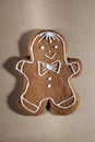 Homemade gingerbread in the shape of a man, covered with glaze on craft paper, Royalty Free Stock Photo