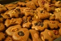 Homemade gingerbreads decorated with various nuts