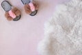 Homemade glamorous women`s slippers on a fluffy pink carpet with place for text. Copy space