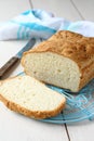 Homemade gluten free bread on blue metal grid