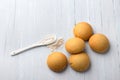 Homemade gluten free cottage cheese rice cookies and spoon with rice flour on light background