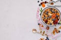 Homemade gluten free granola with nuts and dried fruits on a white table Top view, copy space Royalty Free Stock Photo