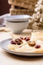 Homemade gluten free rice crepes or pancakes served with dried cranberries and walnuts Royalty Free Stock Photo