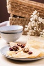 Homemade gluten free rice crepes or pancakes served with dried cranberries and walnuts Royalty Free Stock Photo