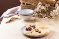 Homemade gluten free rice crepes or pancakes served with dried cranberries and walnuts Royalty Free Stock Photo