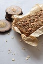 Homemade gluten free sugar free vegetarian snack. Oatmeal bread baked in paper served with whole almonds, flax and amaranth seeds