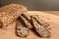 Homemade glutenfree bread with hazelnut and flax seeds on a wooden Board background close-up. Food for diet and health