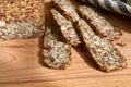 Homemade glutenfree bread with hazelnut and flax seeds on a wooden Board background close-up. Food for diet and health