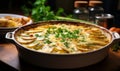 Homemade Golden Brown Potato Gratin in a White Ceramic Dish on a Wooden Table by the Window Freshly Baked and Garnished with Herbs Royalty Free Stock Photo