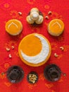 Homemade golden cake with a Crescent moon, served with tea cup and dates. Ramadan background