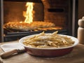 Homemade Goodness. Penne Perfection on a Wooden Table with Oven Ambiance Royalty Free Stock Photo