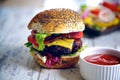 Homemade gourmet burger and side sauce Royalty Free Stock Photo