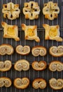 Homemade Gourmet danish puff pastries cooling on wire mesh dark Royalty Free Stock Photo