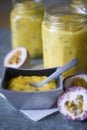 Homemade granadilla curd in glass jars