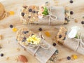 Homemade granola bars with peanut butter and chocolate chips on wooden table, healthy vegan snacks