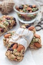 Homemade granola energy bars with figs, oatmeal, almond, dry cranberry and pumpkin seeds, healthy snack, vertical Royalty Free Stock Photo