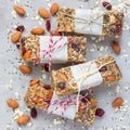 Granola energy bars with figs, oatmeal, almond, dry cranberry, chia and sunflower seeds, square format Royalty Free Stock Photo