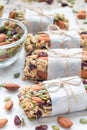 Homemade granola energy bars with figs, oatmeal, almond, dry cranberry and pumpkin seeds, vertical Royalty Free Stock Photo