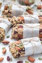 Homemade granola energy bars with figs, oatmeal, almond, dry cranberry and pumpkin seeds, vertical Royalty Free Stock Photo