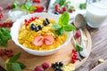 Homemade granola with milk for breakfast top view Healthy tasty breakfast cornflakes with strawberries, raspberries Royalty Free Stock Photo