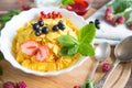 Homemade granola with milk for breakfast top view Healthy tasty breakfast cornflakes with strawberries, raspberries Royalty Free Stock Photo