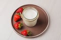 Homemade Greek yogurt in a glass jar ready to eat. Calcium dairy fresh product.