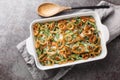 Homemade Green Bean Casserole with crispy fried onions on the baking dish. Horizontal top view Royalty Free Stock Photo