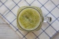 Homemade green cucumber apple smoothie in a glass jar, top view. Flat lay, overhead, from above. Close-up Royalty Free Stock Photo