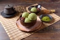 Homemade green tea or matcha ice cream in the wooden bowl and put on bamboo mat Royalty Free Stock Photo