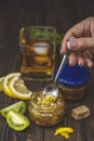 Homemade green tomatoes jam or marmalade with whiskey and lemon in the glass jar on the wooden table Royalty Free Stock Photo