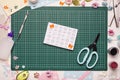 Homemade greeting card and tools on the cutting mat Royalty Free Stock Photo