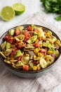 Homemade Grilled Corn Summer Pasta Salad in a Bowl on a white wooden background, low angle view. Close-up Royalty Free Stock Photo