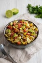 Homemade Grilled Corn Summer Pasta Salad in a Bowl on a white wooden background, low angle view. Close-up Royalty Free Stock Photo