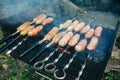 Homemade grilled sausages outdoors. Tasty food for barbecue party Royalty Free Stock Photo