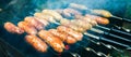 Homemade grilled sausages outdoors. Tasty food for barbecue party Royalty Free Stock Photo
