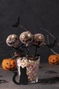 Homemade Halloween cake pops monsters with dark chocolate on gray background. Sweets for kids on Halloween party Royalty Free Stock Photo