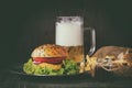 Homemade hamburger with beer and potatoes Royalty Free Stock Photo