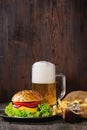 Homemade hamburger with beer and potatoes Royalty Free Stock Photo