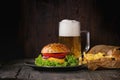 Homemade hamburger with beer and potatoes Royalty Free Stock Photo