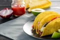 Homemade hard-shell tacos. Ingredients on a table