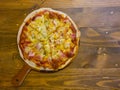 Homemade Hawaiian Pizza on The Wooden Table