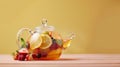 Homemade healthy hot fruit tea with fresh ripe orange, apple, mint leaves and twigs of thyme in glass teapot or kettle Royalty Free Stock Photo