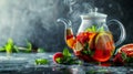 Homemade healthy hot fruit tea with fresh ripe orange, apple, mint leaves and twigs of thyme in glass teapot or kettle Royalty Free Stock Photo