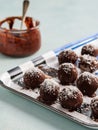 Homemade Healthy Paleo Raw Chocolate Truffles or balls with Nuts, Dates and coconut on light Background Royalty Free Stock Photo