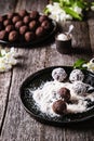 Homemade healthy vegan chocolate balls, truffles, candies sprinkled grated coconut Royalty Free Stock Photo