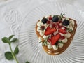 Homemade heart shaped cake with strawberries on a white napkin Royalty Free Stock Photo