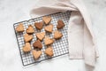 Homemade heart-shaped cookies cool on the grill, valentine`s day gift with love, gluten-free buckwheat flour pastries Royalty Free Stock Photo