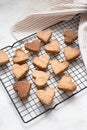 Homemade heart-shaped cookies cool on the grill, valentine`s day gift with love, gluten-free buckwheat flour pastries Royalty Free Stock Photo